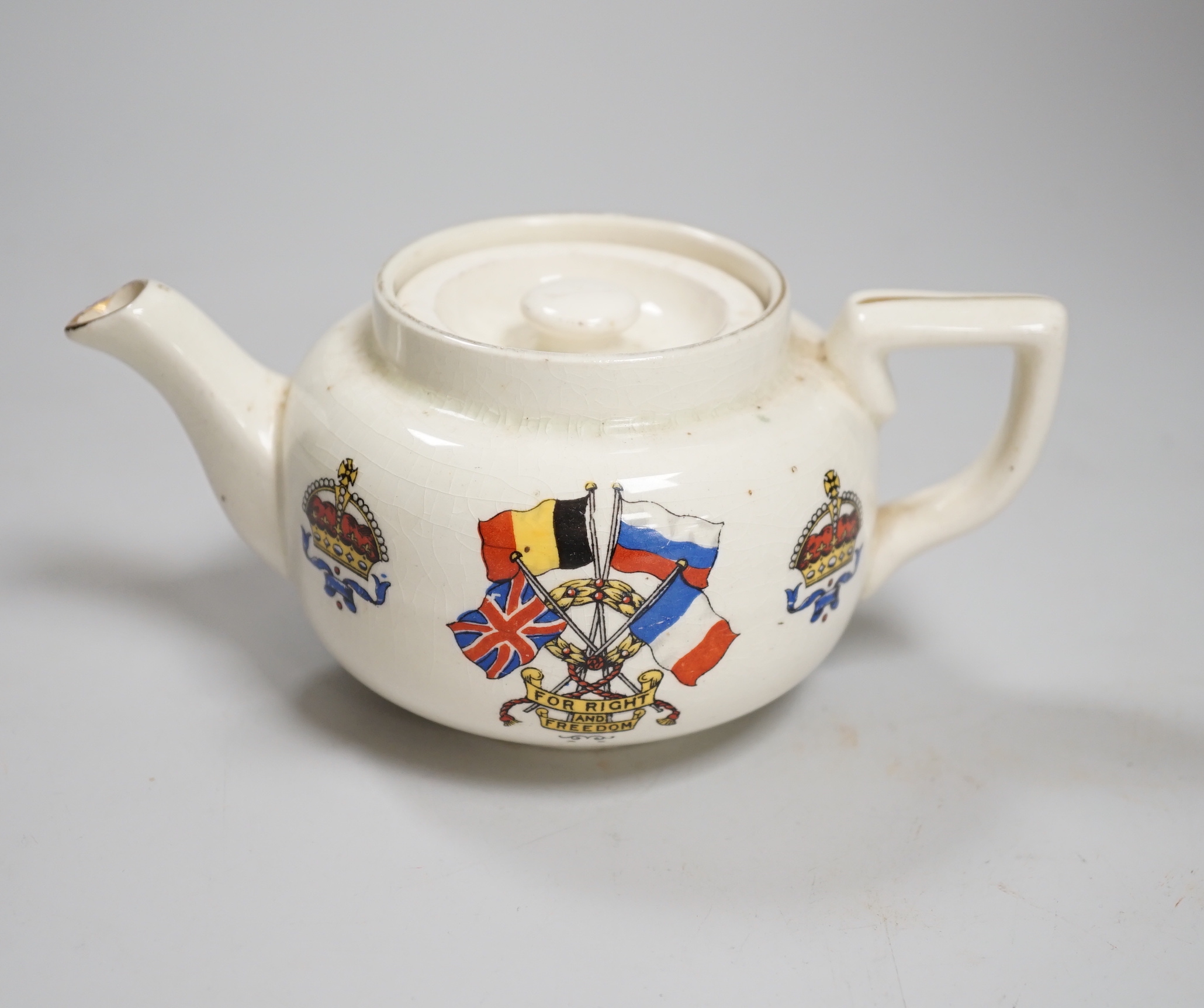 A WWI commemorative teapot with ‘For Right and Freedom’ motto and allied flags, 16cm wide